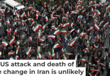 A group of demonstrators in Tehran wave Iranian flags in support of the government on Feb. 28, 2026. AP Photo/Vahid Salemi